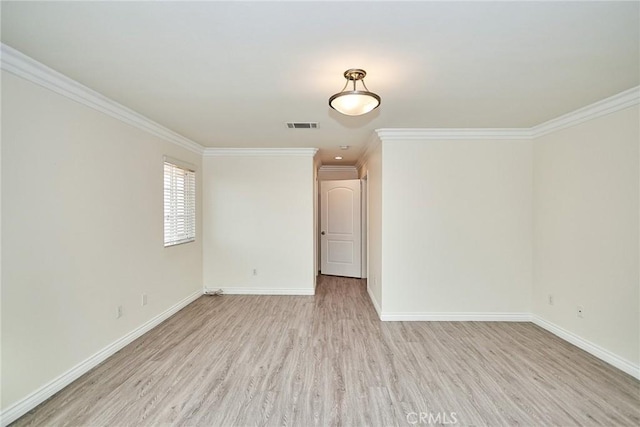 empty room with light hardwood / wood-style floors and ornamental molding