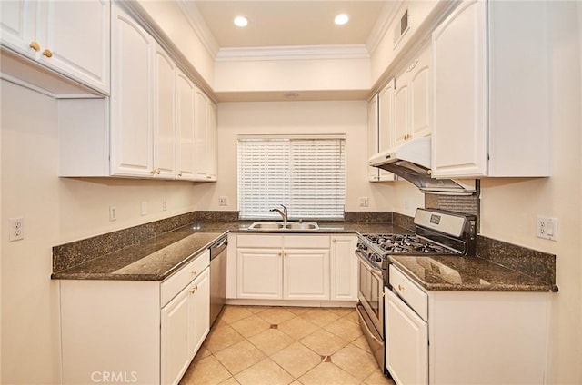 kitchen featuring appliances with stainless steel finishes, white cabinetry, ornamental molding, and sink