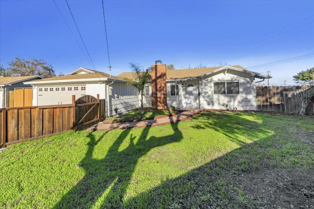 view of front facade with a garage and a front yard