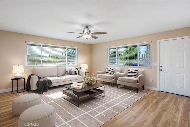 living room with ceiling fan, a healthy amount of sunlight, and hardwood / wood-style flooring