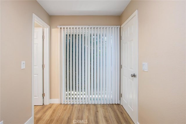 doorway to outside with hardwood / wood-style floors