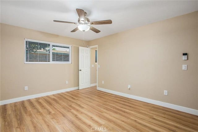 unfurnished room featuring ceiling fan and light hardwood / wood-style flooring