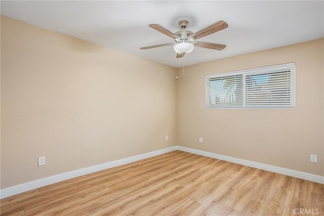 empty room with light wood-type flooring and ceiling fan