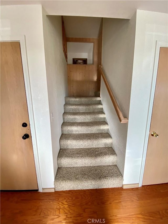 staircase featuring hardwood / wood-style flooring