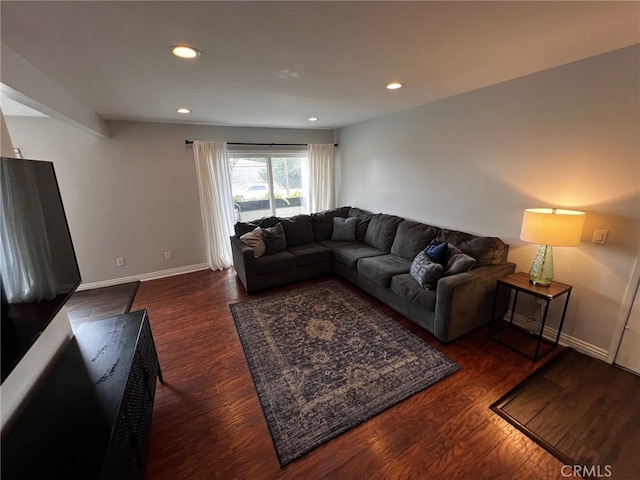 living room with dark hardwood / wood-style floors