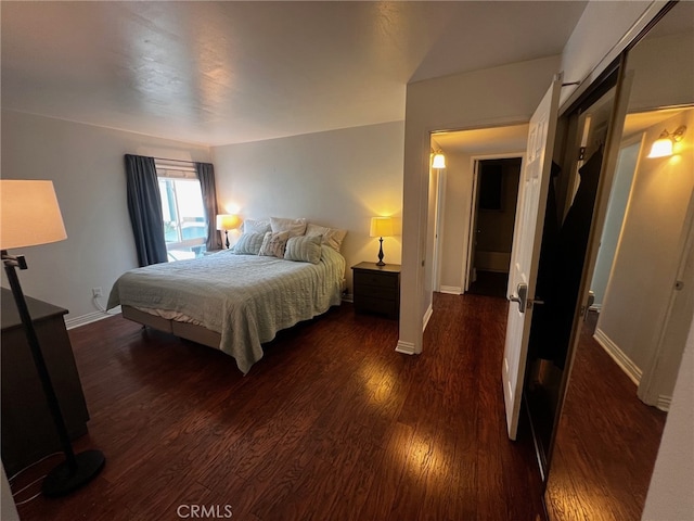 bedroom featuring dark wood-type flooring