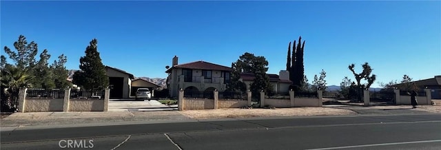 view of front facade with a fenced front yard