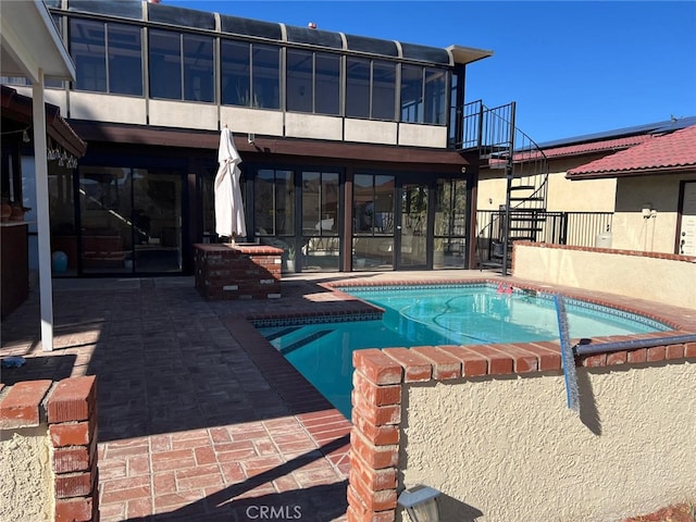 view of swimming pool with stairs, a fenced in pool, and a patio