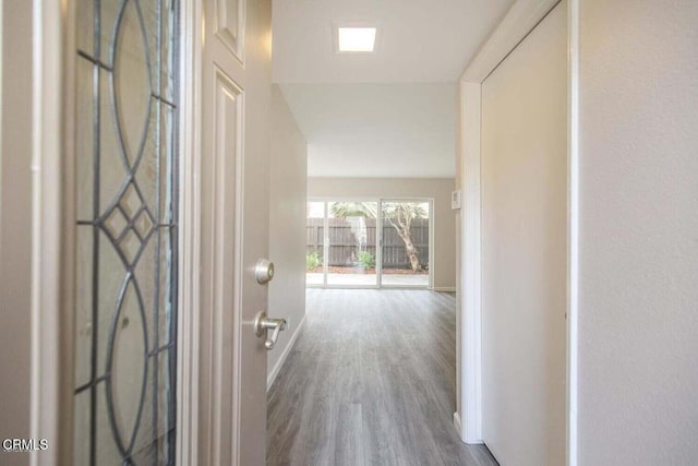 hallway with wood-type flooring