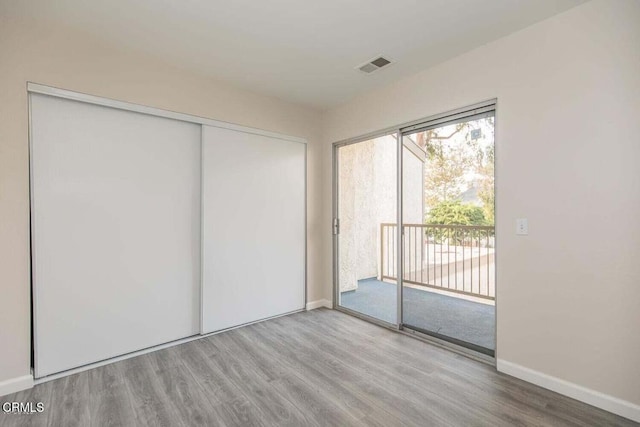784 Seawind Way, Port Hueneme, CA 93041 - unfurnished bedroom featuring access to exterior, wood finished floors, and a closet