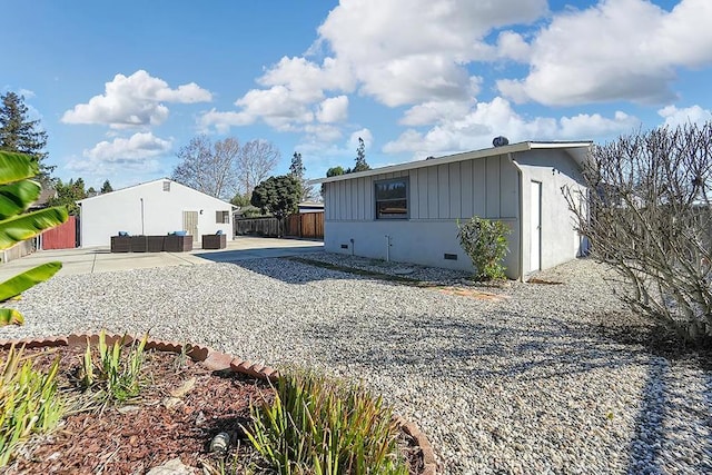 view of home's exterior featuring a patio and an outdoor hangout area