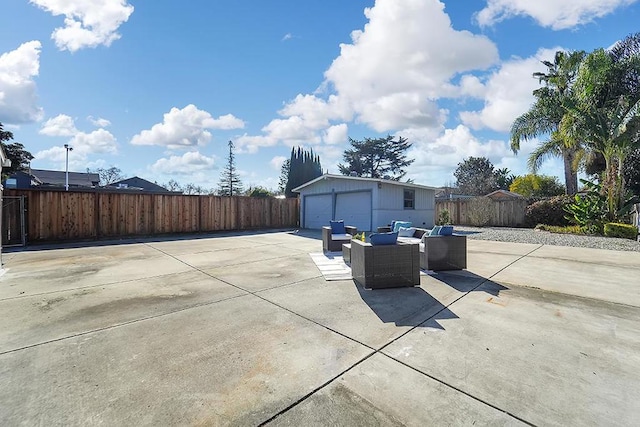 view of patio with an outdoor living space, a garage, and an outdoor structure