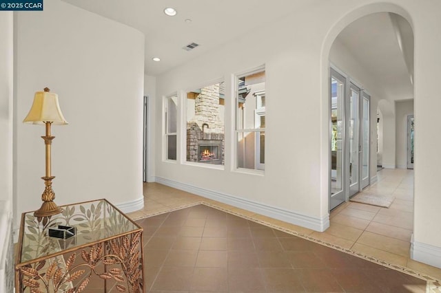 corridor with tile patterned flooring