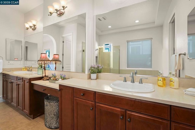 bathroom featuring a shower with door, tile patterned floors, a tray ceiling, and vanity