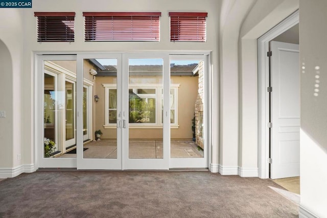 doorway with carpet and french doors