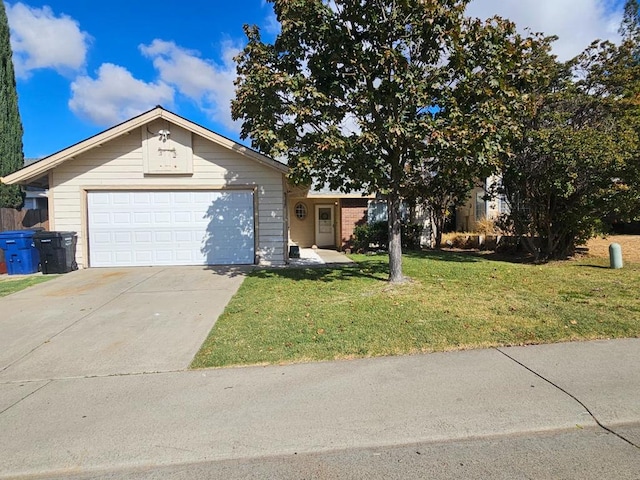 view of front of home with a front lawn and a garage