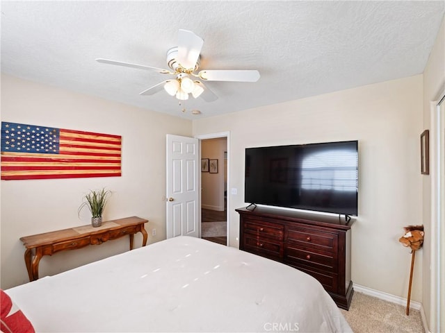 bedroom featuring light carpet and ceiling fan