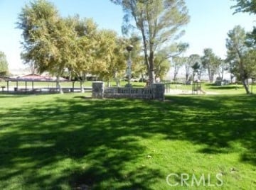 view of home's community with a lawn