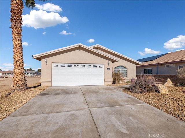 ranch-style house featuring a garage