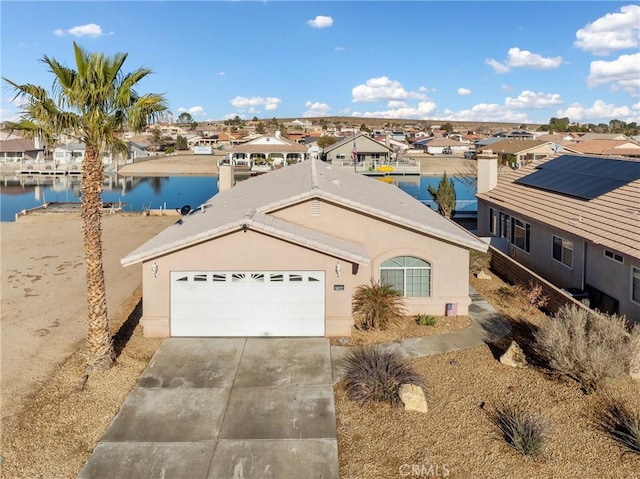 view of front of house featuring a water view and a garage