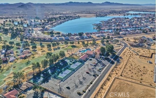 birds eye view of property featuring a water and mountain view