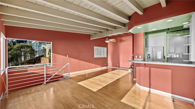 interior space with ceiling fan