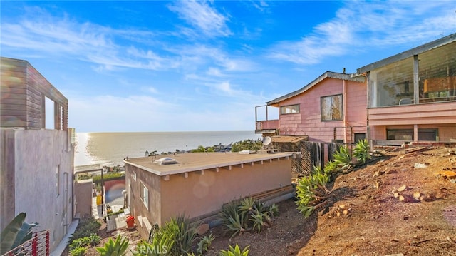 view of home's exterior with a water view