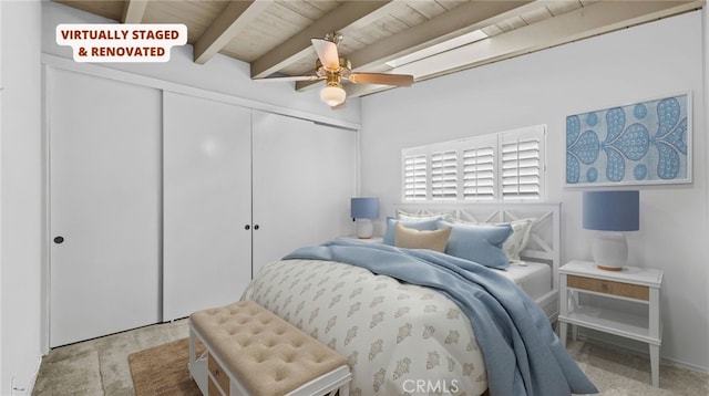 bedroom with ceiling fan, lofted ceiling with beams, a closet, and wooden ceiling