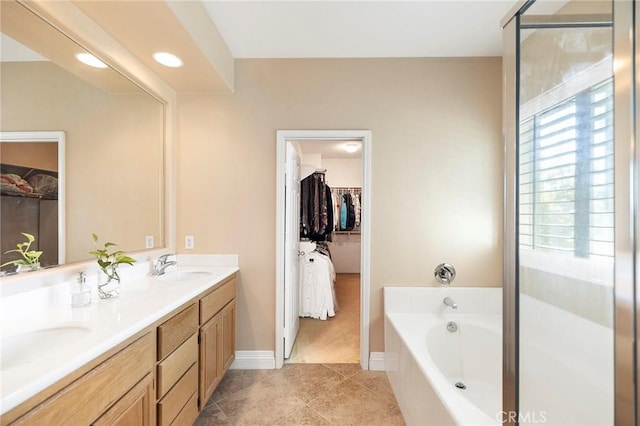 bathroom featuring tile patterned floors, vanity, and plus walk in shower