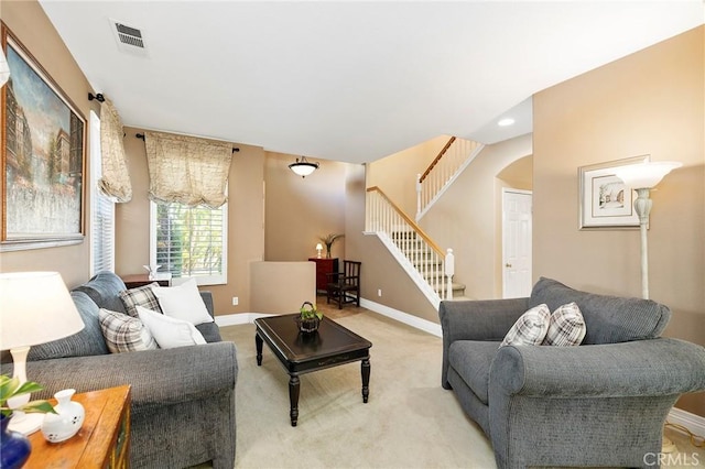 living room featuring light carpet