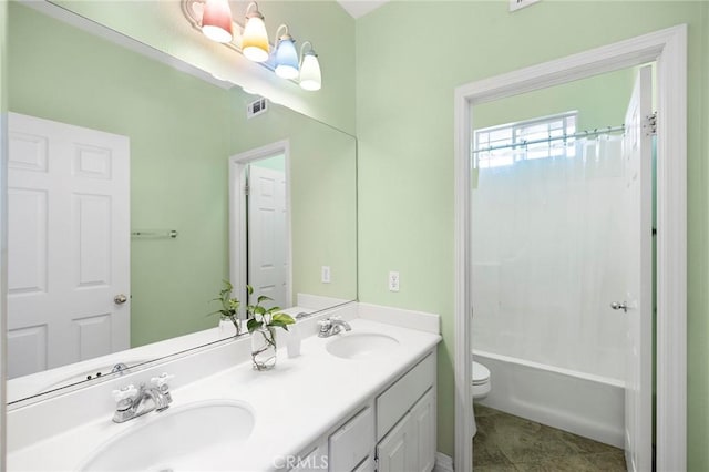 full bathroom with toilet, vanity, tile patterned floors, and shower / bath combo