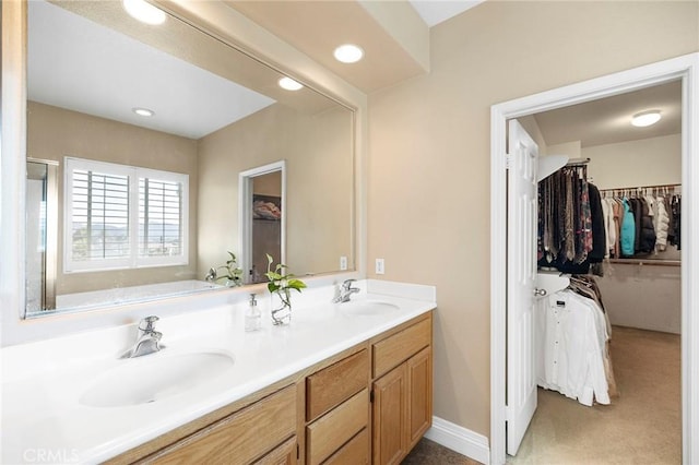 bathroom with vanity and a bathing tub