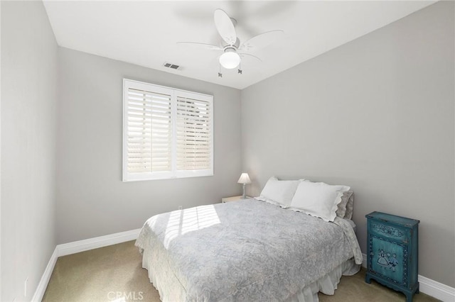 bedroom with ceiling fan and carpet