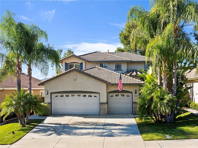 mediterranean / spanish-style home featuring a garage