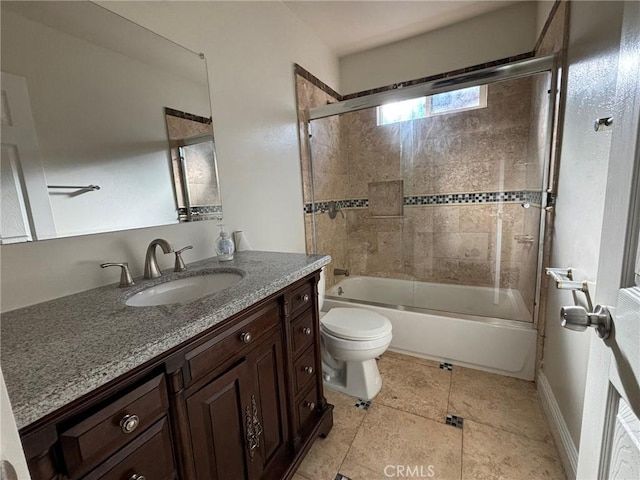 full bathroom featuring enclosed tub / shower combo, vanity, toilet, and tile patterned flooring