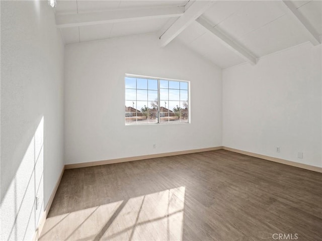 unfurnished room with wood-type flooring and lofted ceiling with beams