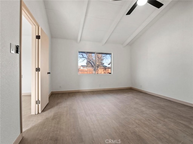 spare room featuring ceiling fan, vaulted ceiling with beams, and light hardwood / wood-style flooring