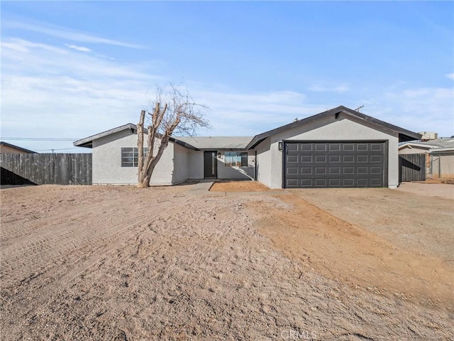 single story home with a garage