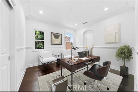 office with dark hardwood / wood-style flooring and crown molding