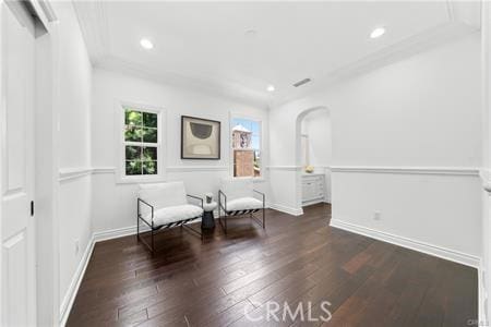 living area featuring dark hardwood / wood-style flooring and plenty of natural light