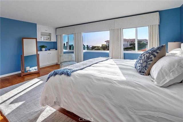 bedroom with wood-type flooring