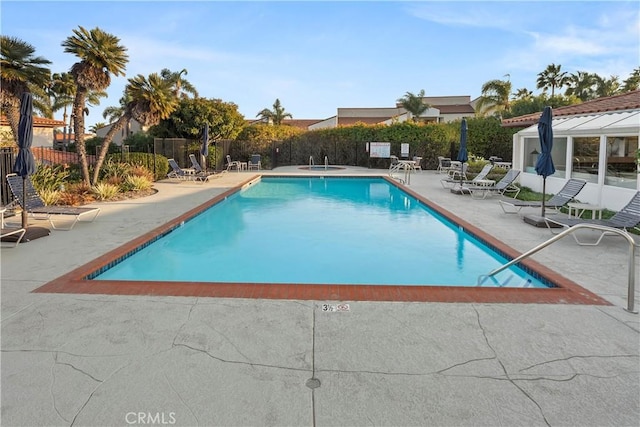 view of swimming pool featuring a patio