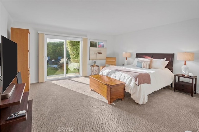 bedroom featuring access to outside and carpet flooring