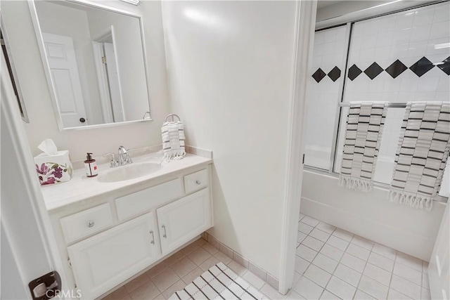 bathroom featuring vanity, tile patterned floors, and shower / bath combination with glass door