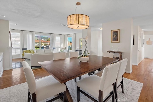 dining area featuring light hardwood / wood-style flooring