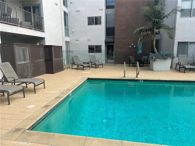 pool with a patio