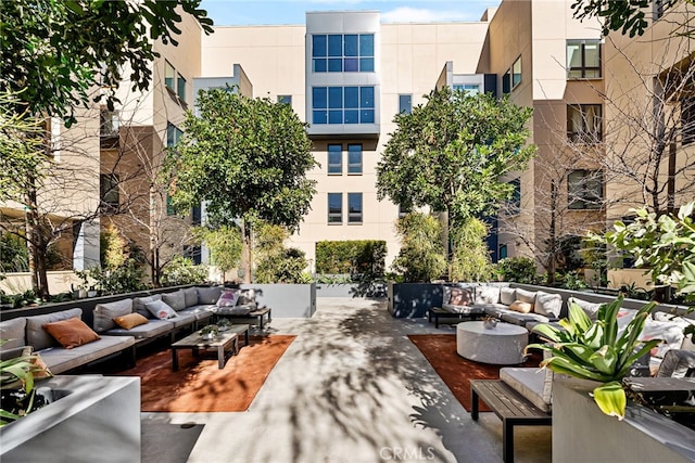 exterior space featuring an outdoor living space and a patio