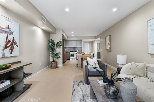 living room with light hardwood / wood-style floors