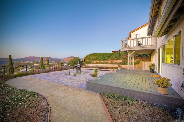 exterior space with a balcony and a deck with mountain view