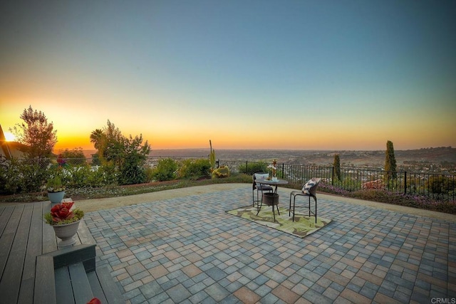 view of patio terrace at dusk